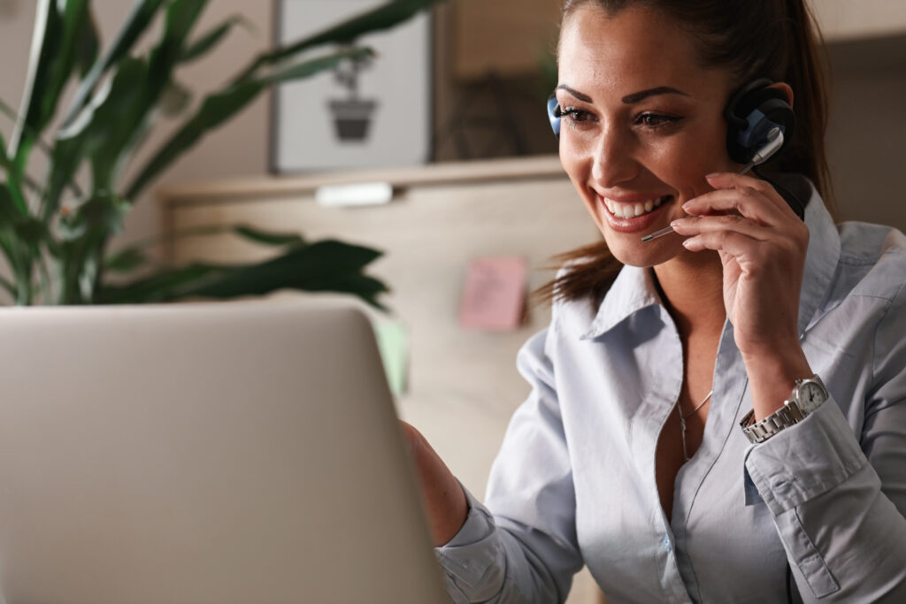 Mississippi Home Mortgage - happy customer service representative talking with customer while using laptop office Scottsdale Mortgage Loans | Best Mortgage Specialist
